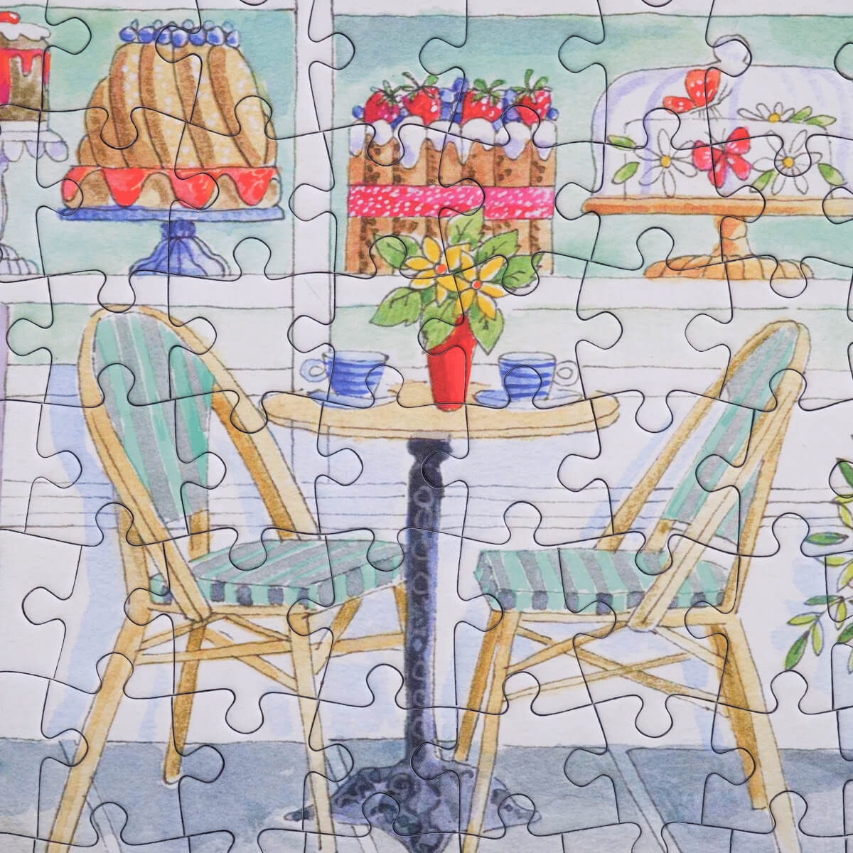 Bloom Puzzles Le Cafe 500 piece Puzzle Close Up of Table and Chairs