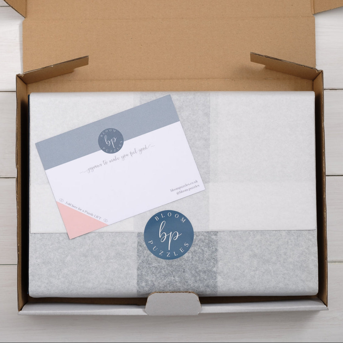 Bloom Puzzles, sent wrapped in tissue paper, in a sturdy box, a treat to receive.