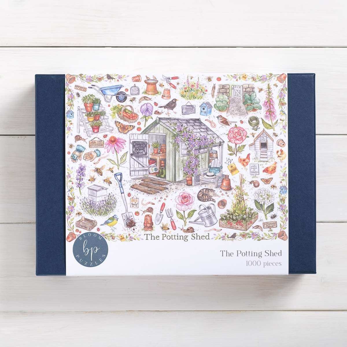 Bloom Puzzles The Potting Shed 1000 Piece Jigsaw Puzzle Front of Box Amy Holliday