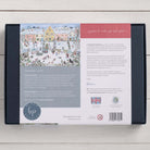 Bloom Puzzles Snowy Village 1000 piece Jigsaw Puzzle Back of Box