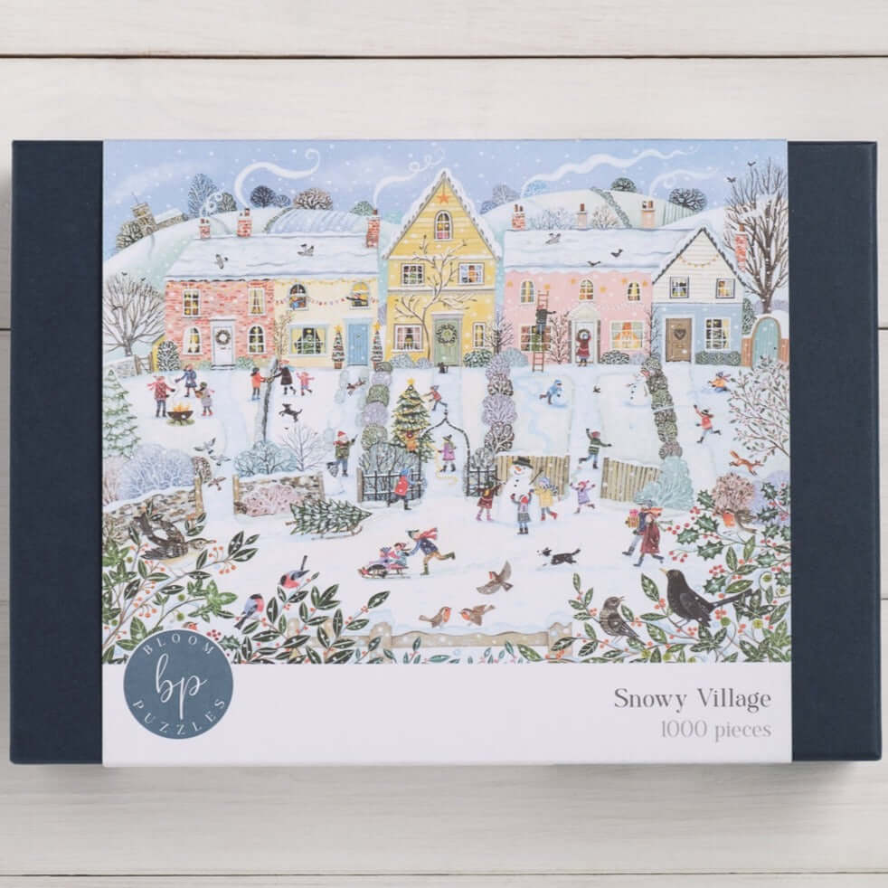 Bloom Puzzles Snowy Village 1000 piece Jigsaw Puzzle Front of Box