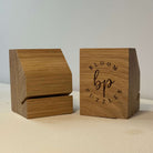 Two wooden puzzle boxes with 'Bloom Puzzles' branding on a neutral background
